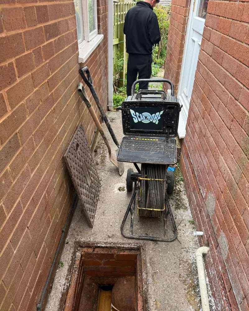 Taunton Drain Rescue engineer setting up a CCTV drain camera at an open inspection chamber